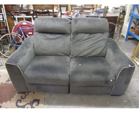 A two seater sofa and two seater companion with adjustable backs, upholstered in a dark grey suede