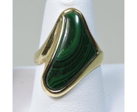 A 14 carat gold malachite ring, of curved asymmetrical design, size M, 7.2g gross