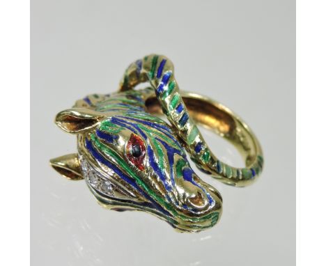 An 18 carat gold, diamond and enamelled ring, in the form of the head of a zebra, with red enamelled eyes and diamond set hea