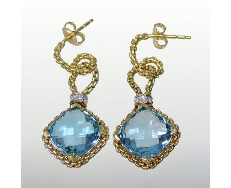 A pair of 18 carat gold, blue topaz and diamond articulated pendant earrings, each suspended with a facet cut stone, within a