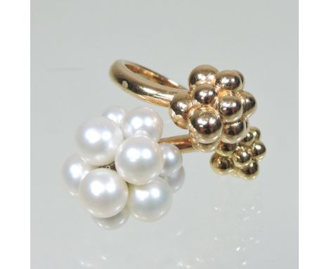 A Boucheron 18 carat two colour gold pearl ring, of triple cluster design, numbered E53066, 3cm overall, size K, 12.8g gross