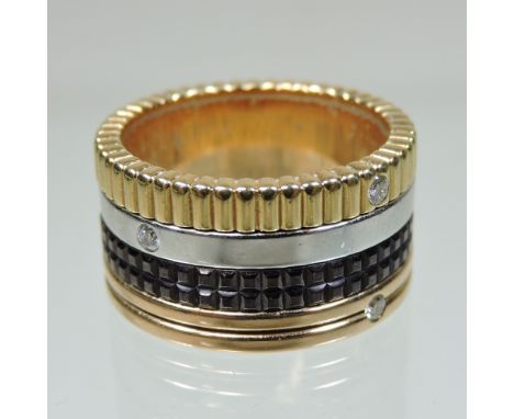 A Boucheron Quatre 18 carat gold and diamond ring, composed of four rotating contrasting bands of white, yellow, rose gold an