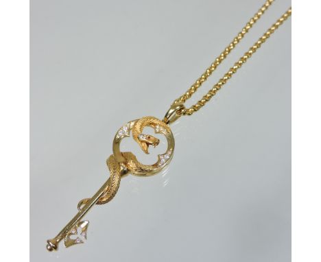 A Magerit Mythology collection 18 carat gold, ruby and diamond pendant necklace, in the form of a snake entwined around a key