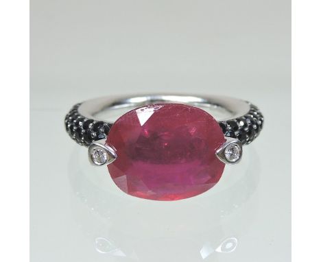 A large Al Coro 18 carat gold ruby and diamond ring, with gem set shoulders, size P, 8.4g gross