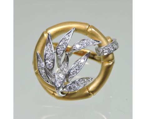 A Carrera y Carrera 18 carat gold and diamond designer ring, in the form of bamboo leaves, within a simulated bamboo surround