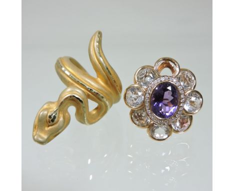 A 14 carat matt gold ring, in the form of a coiled snake, size K, 2.8g gross, together with an 18 carat gold cluster ring, si
