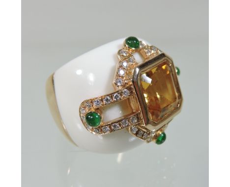 A large Kabana style 18 carat gold, golden topaz, diamond and emerald cabochon designer ring, with carved white onyx shoulder