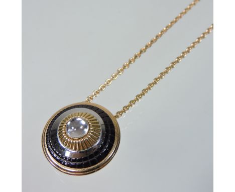 A Boucheron Quatre 18 carat gold pendant necklace, of target design, the circular pendant set with a cabochon quartz, with a 