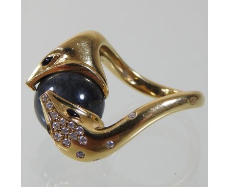 A Boucheron 'Serpent Boheme' 18 carat gold, agate and diamond ring, in the form of a two headed snake clasping a black orb, o
