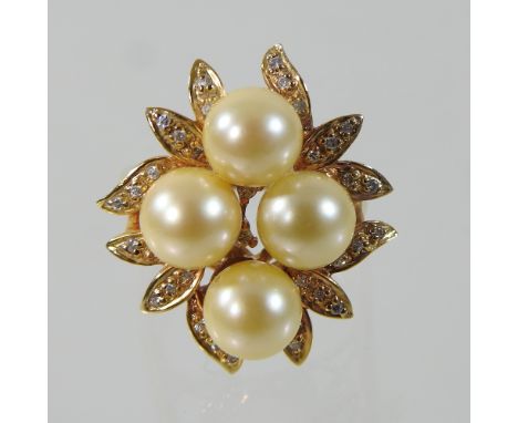 An 18 carat gold pearl and diamond cluster ring, set with four central pearls, within a foliate diamond encrusted openwork su