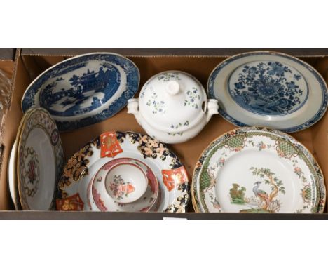 An antique Delft blue and white plate painted with flowers in the Chinese taste, a Regency porcelain tea-bowl and saucer (bow