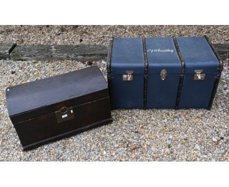 An old wooden dome top trunk, to/w a blue canvas luggage trunk, stencilled 'PJ Wheatley' (2)