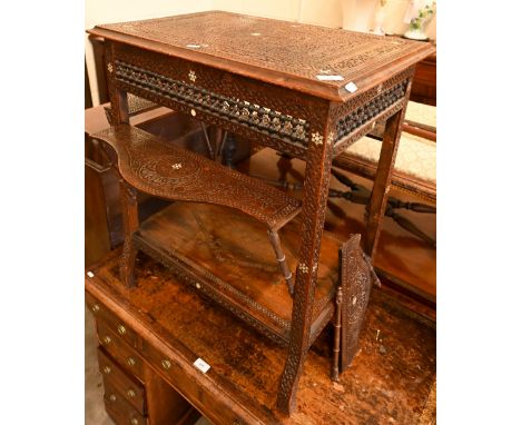 A late 19th century Syrian profusely carved hardwood occasional table inlaid with mother-of-pearl stars, each side with mashr