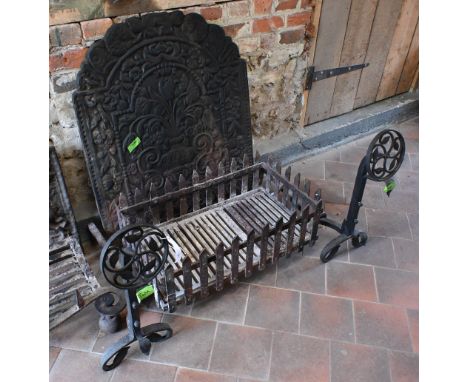 A substantial old cast iron fire back 73 cm x 91 cm h to/with a pair of Arts &amp; Crafts style fire dogs and grate, 118 cm w