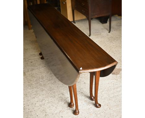 Blanchards of Winchester, a fine quality traditional solid mahogany wake dining table, the oval drop leaf top raised on eight