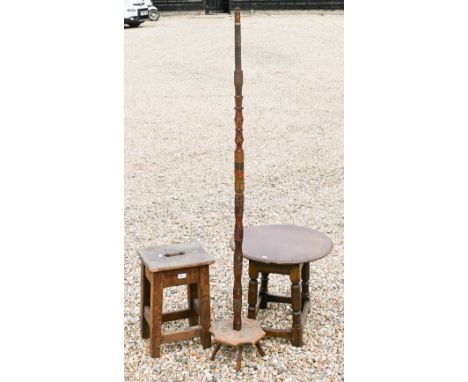 An old pine coaching stool to/w a small joint oak circular top occasional table and a primitive carved folk art stand (3) 