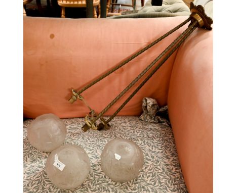 An Art Deco brass ceiling light with three frosted glass globe shades, 75 cm high approx