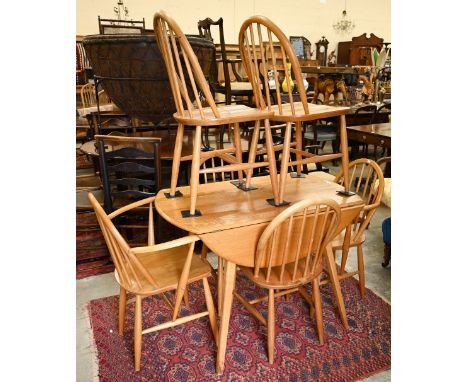 AMENDMENT - A mid-century Ercol Windsor elm and beech dining table with elm drop leaf top (replaced hinges) on splayed beech 