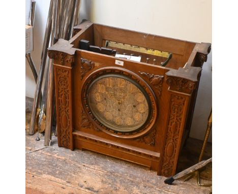 A substantial triple fusee musical clock movement, previously an Arts &amp; Crafts oak longcase clock, the circular engraved 