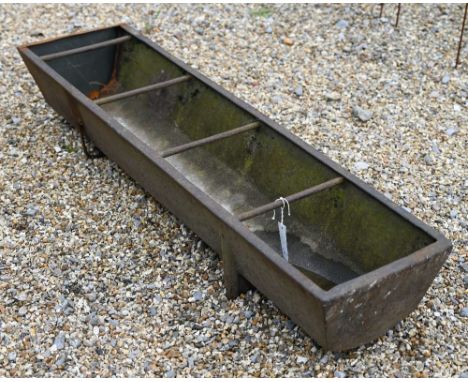 A cast iron feeding trough or garden planter with dividing bars, 130 cm w x 32 cm d x 22 cm h