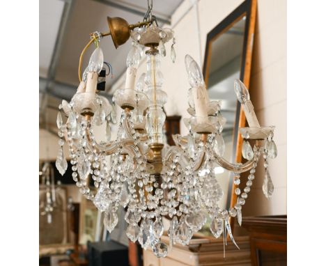 A vintage French brass and glass six branch chandelier hung with faceted glass drops 