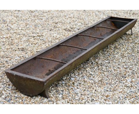 A cast iron feeding trough or garden planter with dividing bars, 164 cm w x 30 cm d x 16 cm h