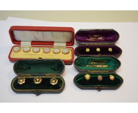 A cased set of three 15ct gold studs set diamonds; together with a similar cased set of three 15ct gold studs set pearls; a c