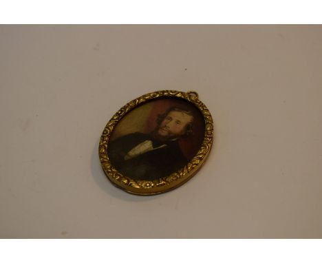 A gold framed oval portrait miniature frame, enclosing watercolour portrait of Victorian gentleman, 5.3cm.