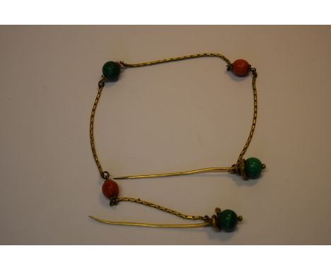 A Victorian gilt metal cloak chain set malachite and coral beads, having snake twist finials to the pins.