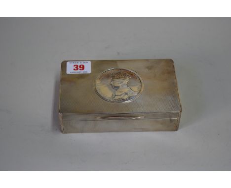 A silver engine turned rectangular cigarette box, by The Goldsmiths & Silversmiths Company Ltd, London 1937, the lid decorate