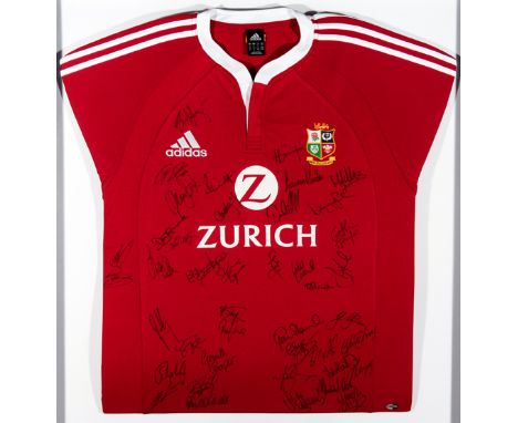 A framed British & Irish Lions shirt signed by the 2005 touring team to New Zealand,signatures in black marker pen including 