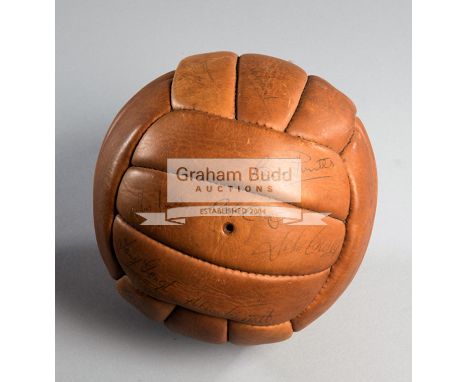 A football signed by the Hereford United team in the John Charles player/manager era,brown leather football extensively signe