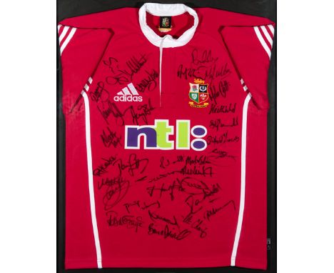 Framed British & Irish Lions shirt signed by the touring team to Australia in 2001,signatures in black marker pen including S