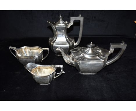 A FOUR PIECE SILVER TEA SET The set comprising of a teapot, coffee/hot water jug, twin handled sugar bowl and creamery of geo