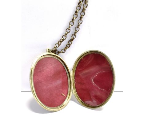 AN EARLY 20TH CENTURY LARGE WHITE METAL LOCKET WITH CHAIN the unmarked locket, heavily embossed with floral and Greek key pat