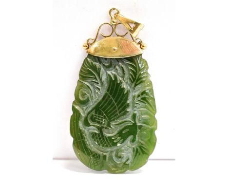 A VINTAGE 9CT GOLD MOUNTED JADE PENDANT PIECE The carved spinach Jade pendant with 9ct gold scroll top mount, hallmarked for 