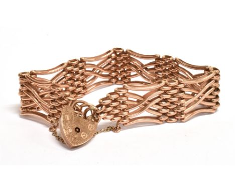 A 9CT ROSE GOLD HEART PADLOCK Fancy gate bracelet, width 1.2cm, length 19cm, hallmarked for Birmingham 1989, jump ring with s