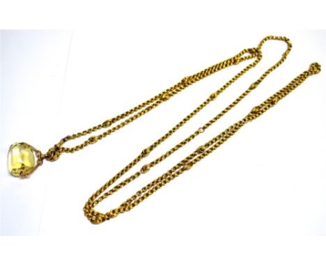 A YELLOW METAL LONG CHAIN AND CITRINE SPINNER The Long chain comprising of belcher and fancy links with an attached lobster c