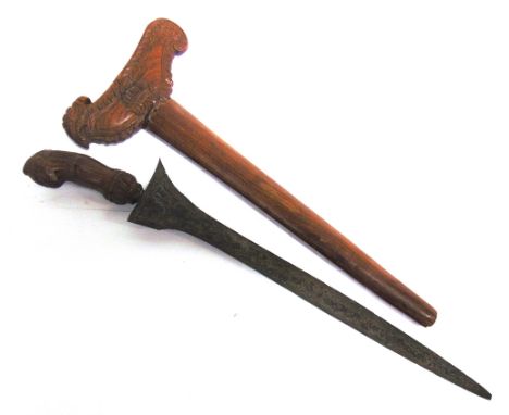 MILITARIA - AN INDONESIAN KRIS  of typical form, the 37cm straight blade with decorative pamor, the hardwood hilt with carved