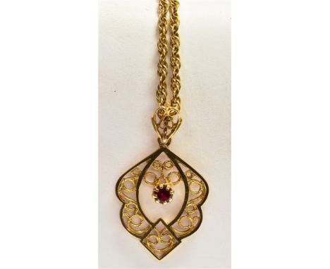 A 9CT GOLD SPINEL PENDANT AND CHAIN The pendant of openwork and fillagree design, centrally set with a single pink spinel, ha