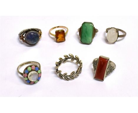 A COLLECTION OF SEVEN VINTAGE RINGS the rings in gold plated silver, silver and white metal, stones include citrine, opalesce