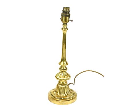 A 20thC brass table lamp, the shaped cylindrical stem with bell flower double stepped base, modern fitting, 40cm high.