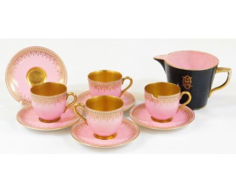 An early 20thC Royal Worcester cabinet cup and saucer set, on pink ground with a white and gilt beading and further decoratio