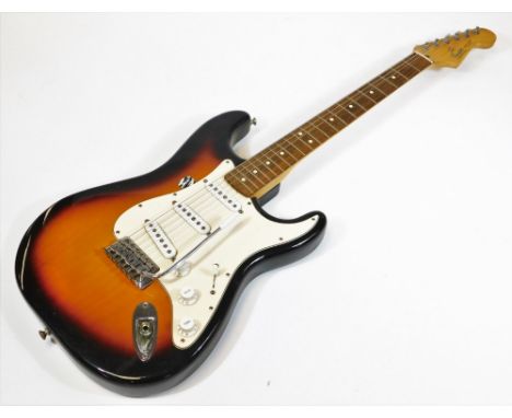 A Fender Stratocaster model electric guitar, made in Mexico, in two colour sunburst finish, having three single coil pickups,