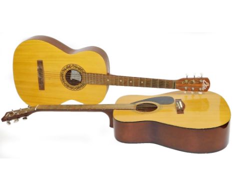 Two acoustic guitars, comprising a Yamaha F310 and an EKO Italian small scale  student model.