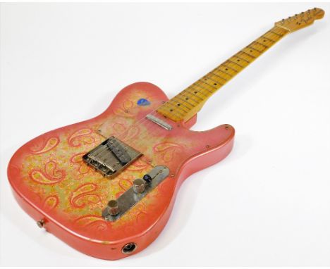 A Fender Telecaster made in Japan paisley model electric guitar, having two single coil pickups with maple neck, worn gold co