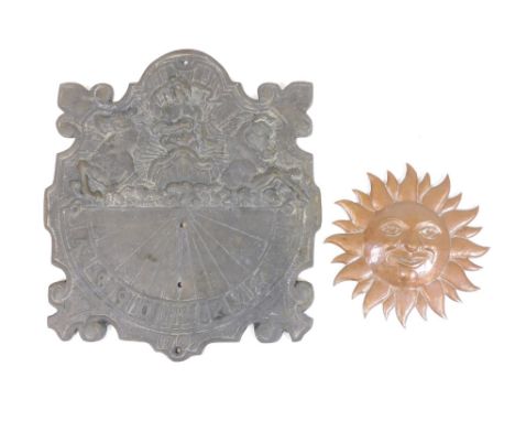 A heavy iron sundial, raised with a figure of Britannia, with Arabic numerals bearing the date 1705, 15cm high and a copper s