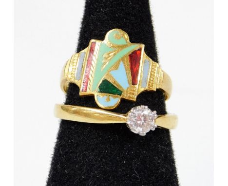 A solitaire ring, on part pierced shank with claw set stone, marks pitted, size L, further enamel style dress ring, unmarked.