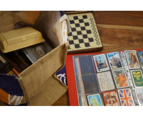 Box of vintage games to include an album of playing cards 