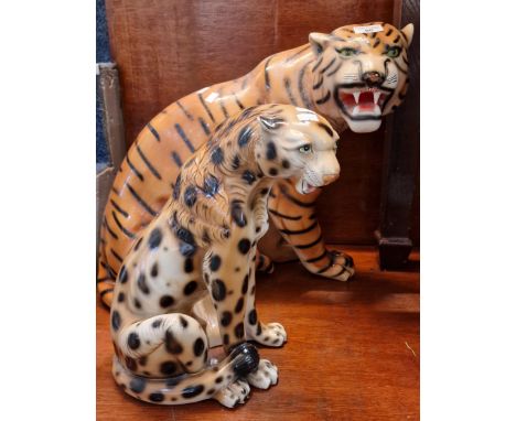 Two ceramic studies of a seated Tiger and seated Leopard. (2) (B.P. 21% + VAT).&nbsp;Minor nibble and paint loss in places, b